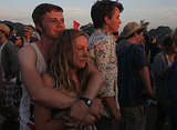 This pair got close to enjoy the sunrise together at the Glastonbury festival.
