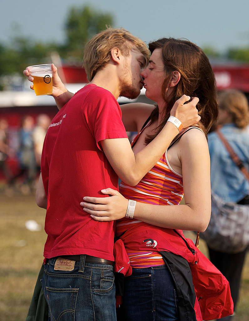 These young lovers managed to balance the beer and kiss at the same time at Roskilde Festival in Denmark. Well done.
