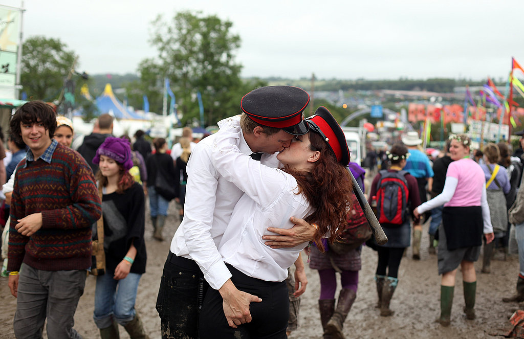 This guy was not afraid to give his lady friend's backside a squeeze at Glastonbury.
