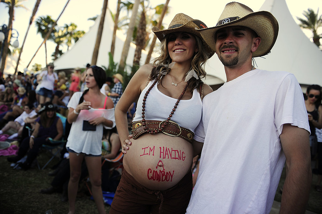 This husband and wife let us know they were "having a cowboy" at Stagecoach country music festival.
