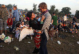 Rise and shine! A couple held each other during sunrise at the Glastonbury festival.
