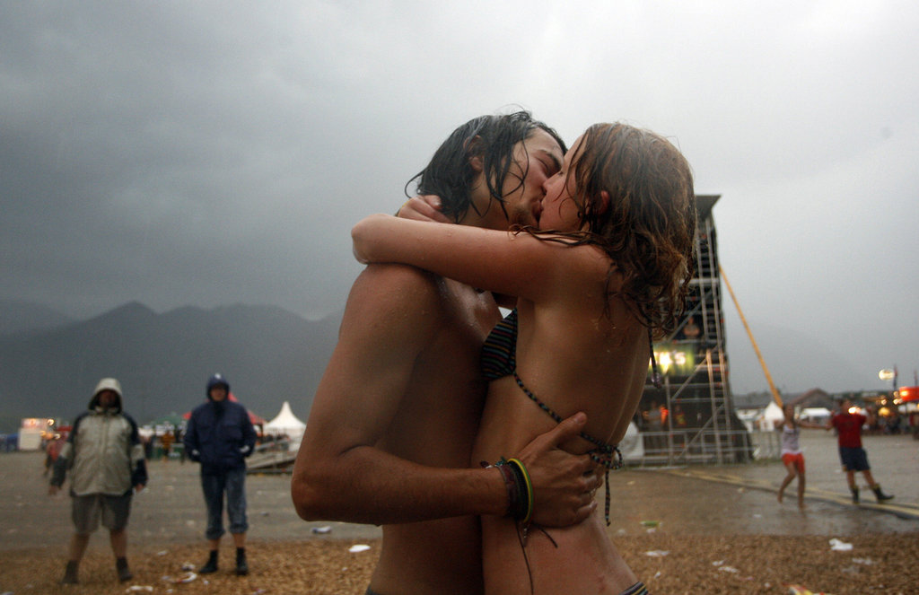 This pair smooched in the rain at the Chiemsee Reggae Summer music festival in Uebersee, southern Germany. 
