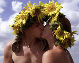 Bloomin' buddies smooched at the Woodstock Stop music festival in Zary, Poland.
