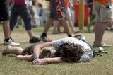 A pair relaxed together during the Isle of Wight Festival in the Isle of Wight, England.
