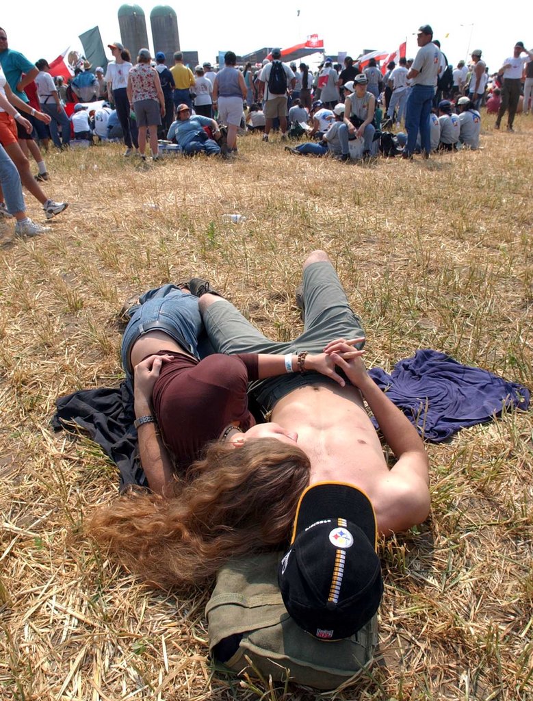 A couple laid down together at World Youth Day Community Festival in Southwestern Ontario.
