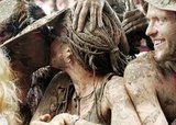 A very muddy twosome kissed at the Glastonbury Music Festival in England.
