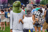 A masked pair of lovebirds attended the Catalpa Festival at Randall's Island in New York City. 
