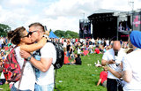 Fans embraced at the V Festival at Weston Park in Staffordshire, England. 
