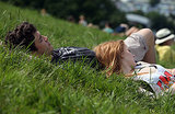 A pair rested in the grass at Glostonbury Festival in the UK.
