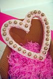 Use this heart-shaped marquee DIY to make your own cute photo booth prop.
Photo by Serendipity Studios
