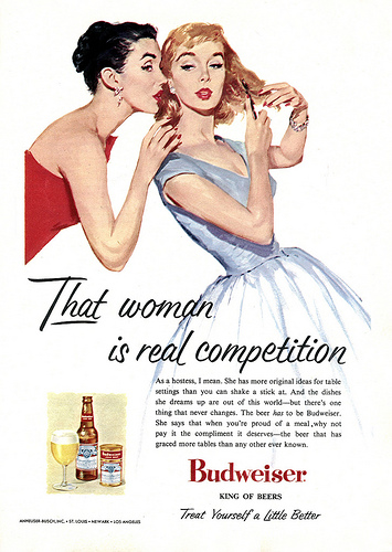 This 1956 ad hopes to convince housewives that Budweiser will help them win the competition for best hostess ever. The copy reads, "The beer has to be Budweiser. She says that when you're proud of a meal, why not pay it the compliment it deserves — the beer that has graced more tables than any other ever known." 
